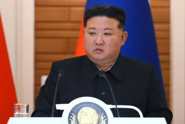 North Korean leader Kim Jong Un, dressed in an all-black outfit, attends a joint press conference with Russian President Vladimir Putin following bilateral talks at the Kumsusan State Residence in Pyongyang, North Korea.